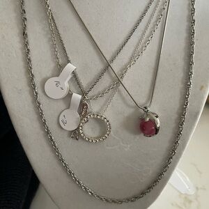 Collection of five Silver tone chains and three pendants.